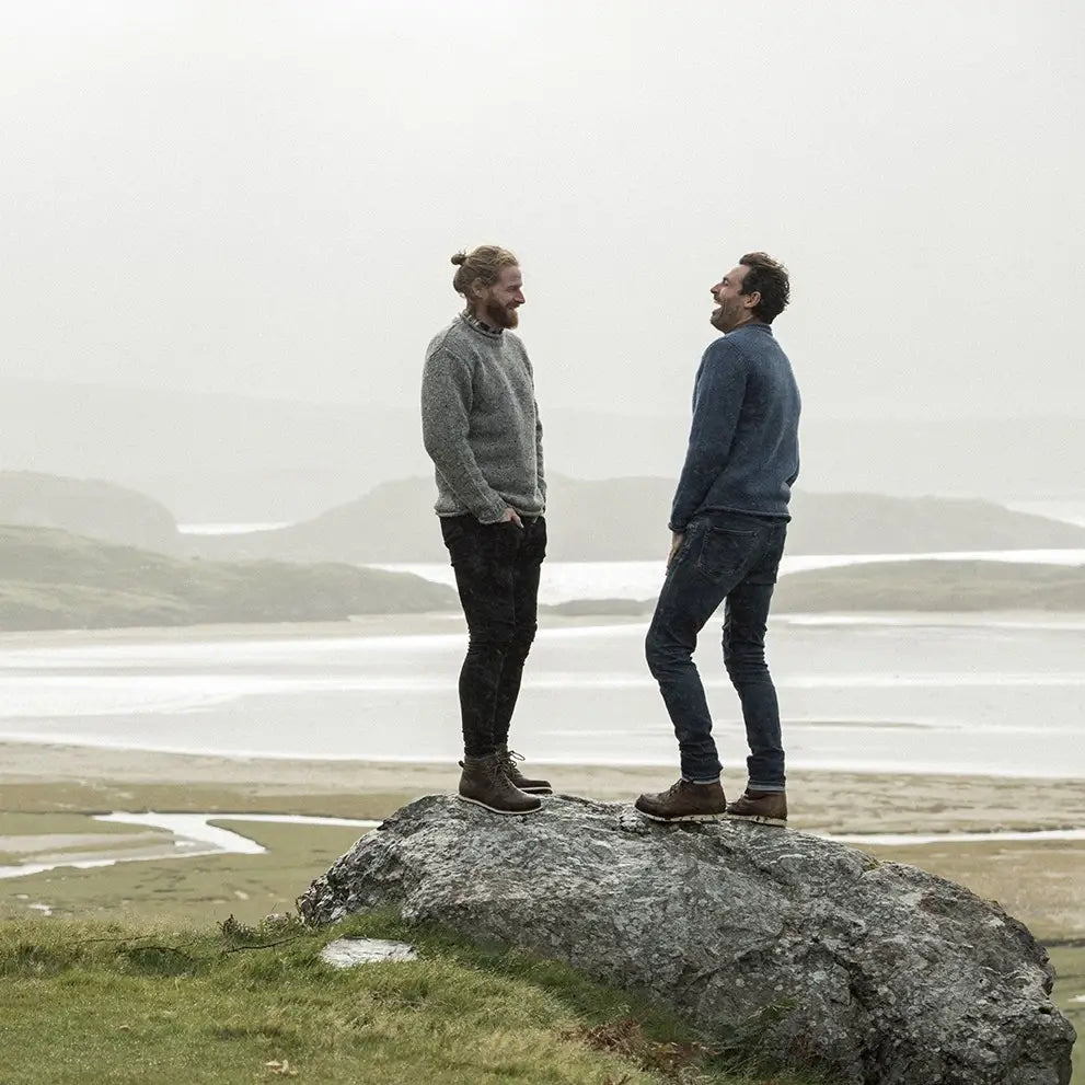 CG623-NVYMD Men's Donegal Tweed Roll Neck Aran Sweater Gray Lifestyle View Creative Irish Gifts