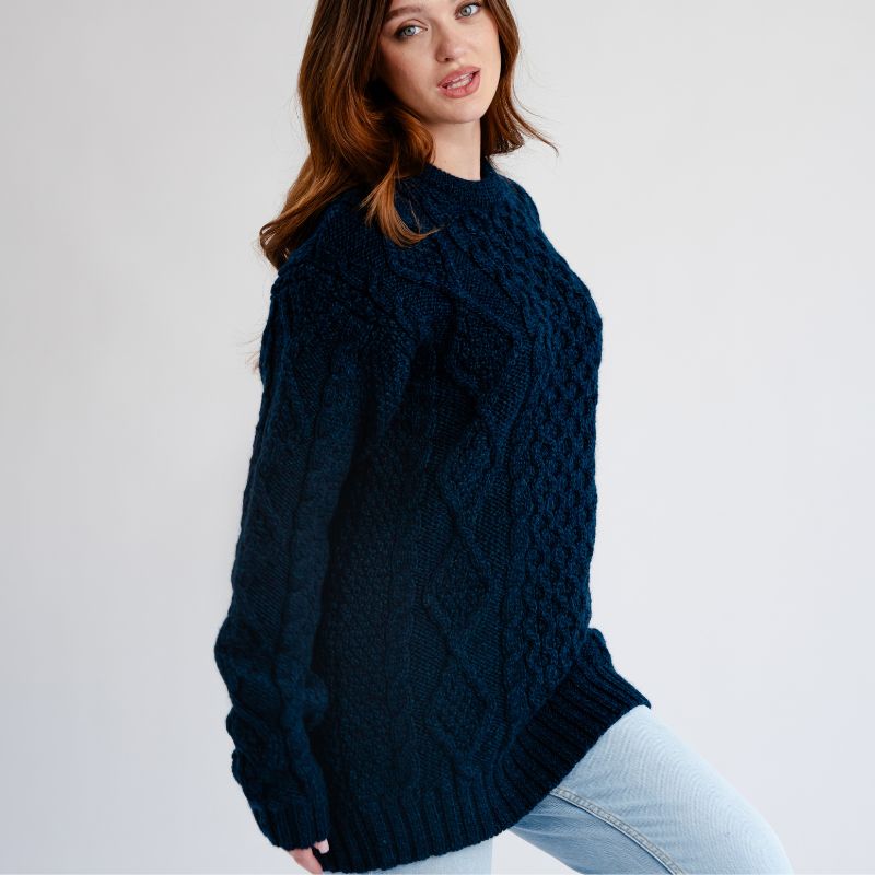 Women's Cable Aran Knit Fisherman Sweater, Navy side view studio Creative Irish Gifts
