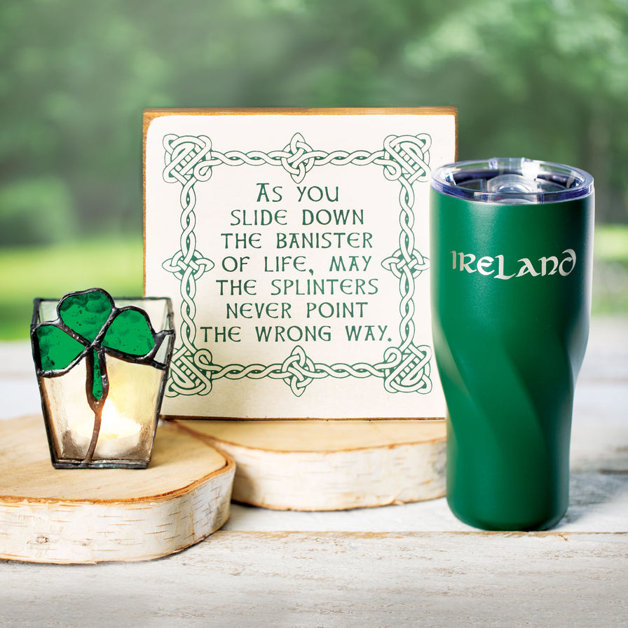 Group shot of "Slide down the Banister of Life" wood sign, Green Ireland insulated tumbler, and Shamrock Votive Holder