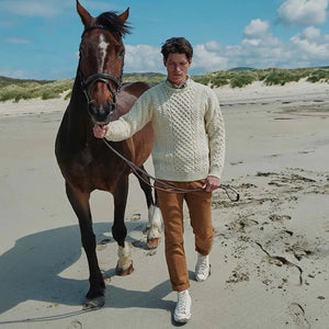 CN025-SWT-SM Traditional Wool Crew Neck Aran Sweater Cream Lifestyle View Creative Irish gift