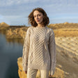 FL194-609 Women's Cable Aran Knit Fisherman Sweater, Lifestyle Parsnip Front Creative Irish Gifts
