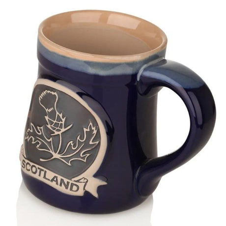 GA-PT1009-BLUE Hand Painted Stoneware Embossed Thistle Mug, Blue Side View Creative Irish Gifts.com