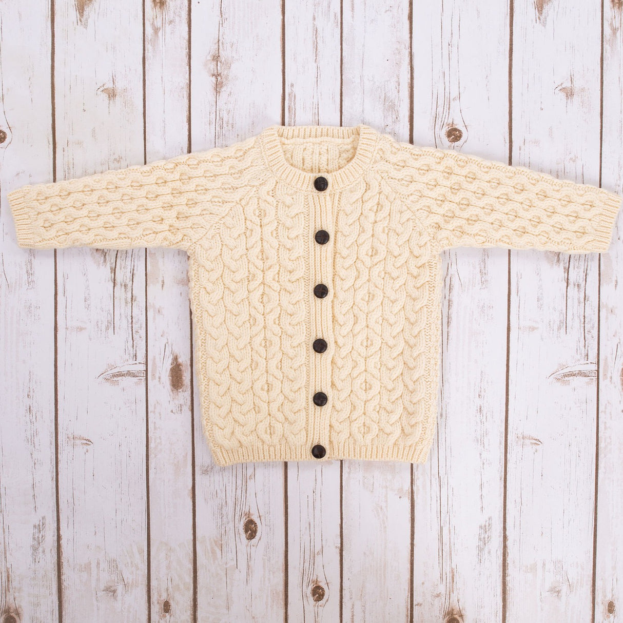 MK101-100 Kids Traditional Merino Wool Aran Button Up Cardigan, Natural Front Creative Irish gift