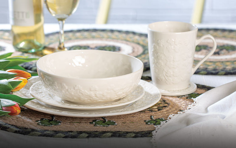Belleek Feild Of Shamrocks Parian China table setting including coffee mug, plate, bowl, and saucer